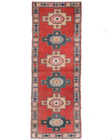 Vintage Turkish runner rug in living room setting, old rug, antique rug, pastel colors, faded colors, Turkish rug, vintage rug, soft rug, Portland, Oregon, rug store, rug shop, local shop