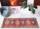 Vintage Turkish runner rug in living room setting, old rug, antique rug, pastel colors, faded colors, Turkish rug, vintage rug, soft rug, Portland, Oregon, rug store, rug shop, local shop