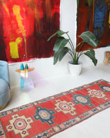Vintage Turkish runner rug in living room setting, old rug, antique rug, pastel colors, faded colors, Turkish rug, vintage rug, soft rug, Portland, Oregon, rug store, rug shop, local shop