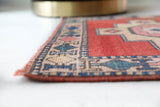 Vintage Turkish runner rug in living room setting, old rug, antique rug, pastel colors, faded colors, Turkish rug, vintage rug, soft rug, Portland, Oregon, rug store, rug shop, local shop