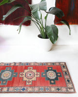 Vintage Turkish runner rug in living room setting, old rug, antique rug, pastel colors, faded colors, Turkish rug, vintage rug, soft rug, Portland, Oregon, rug store, rug shop, local shop