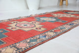 Vintage Turkish runner rug in living room setting, old rug, antique rug, pastel colors, faded colors, Turkish rug, vintage rug, soft rug, Portland, Oregon, rug store, rug shop, local shop