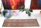 Vintage Turkish runner rug in living room setting, old rug, antique rug, pastel colors, faded colors, Turkish rug, vintage rug, soft rug, Portland, Oregon, rug store, rug shop, local shop
