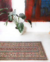 Vintage Turkish runner rug in living room setting, old rug, antique rug, pastel colors, faded colors, Turkish rug, vintage rug, soft rug, Portland, Oregon, rug store, rug shop, local shop