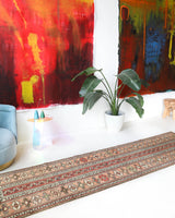 Vintage Turkish runner rug in living room setting, old rug, antique rug, pastel colors, faded colors, Turkish rug, vintage rug, soft rug, Portland, Oregon, rug store, rug shop, local shop