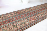 Vintage Turkish runner rug in living room setting, old rug, antique rug, pastel colors, faded colors, Turkish rug, vintage rug, soft rug, Portland, Oregon, rug store, rug shop, local shop