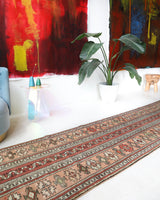 Vintage Turkish runner rug in living room setting, old rug, antique rug, pastel colors, faded colors, Turkish rug, vintage rug, soft rug, Portland, Oregon, rug store, rug shop, local shop