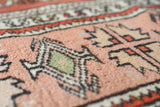 Vintage Turkish runner rug in living room setting, old rug, antique rug, pastel colors, faded colors, Turkish rug, vintage rug, soft rug, Portland, Oregon, rug store, rug shop, local shop