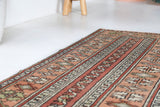 Vintage Turkish runner rug in living room setting, old rug, antique rug, pastel colors, faded colors, Turkish rug, vintage rug, soft rug, Portland, Oregon, rug store, rug shop, local shop