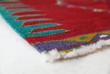 Vintage kilim rug in living room setting, bright colors, wild shaman, soft rug, bold color, Portland, Oregon, rug store, rug shop, local shop, vintage rug, modern kilim, warm colors, antique kilim rug