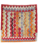 Vintage kilim rug in living room setting, old rug, antique rug, pastel colors, faded colors, Turkish rug, vintage rug, soft rug, Portland, Oregon, rug store, rug shop, local shop, earthy tones, earthy colors, warm colors