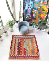 Vintage kilim rug in living room setting, old rug, antique rug, pastel colors, faded colors, Turkish rug, vintage rug, soft rug, Portland, Oregon, rug store, rug shop, local shop, earthy tones, earthy colors, warm colors