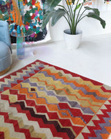 Vintage kilim rug in living room setting, old rug, antique rug, pastel colors, faded colors, Turkish rug, vintage rug, soft rug, Portland, Oregon, rug store, rug shop, local shop, earthy tones, earthy colors, warm colors