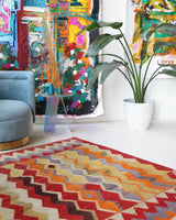 Vintage kilim rug in living room setting, old rug, antique rug, pastel colors, faded colors, Turkish rug, vintage rug, soft rug, Portland, Oregon, rug store, rug shop, local shop, earthy tones, earthy colors, warm colors