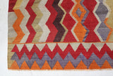Vintage kilim rug in living room setting, old rug, antique rug, pastel colors, faded colors, Turkish rug, vintage rug, soft rug, Portland, Oregon, rug store, rug shop, local shop, earthy tones, earthy colors, warm colors