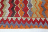 Vintage kilim rug in living room setting, old rug, antique rug, pastel colors, faded colors, Turkish rug, vintage rug, soft rug, Portland, Oregon, rug store, rug shop, local shop, earthy tones, earthy colors, warm colors