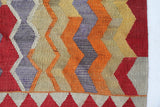 Vintage kilim rug in living room setting, old rug, antique rug, pastel colors, faded colors, Turkish rug, vintage rug, soft rug, Portland, Oregon, rug store, rug shop, local shop, earthy tones, earthy colors, warm colors