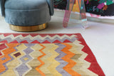 Vintage kilim rug in living room setting, old rug, antique rug, pastel colors, faded colors, Turkish rug, vintage rug, soft rug, Portland, Oregon, rug store, rug shop, local shop, earthy tones, earthy colors, warm colors