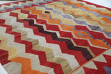Vintage kilim rug in living room setting, old rug, antique rug, pastel colors, faded colors, Turkish rug, vintage rug, soft rug, Portland, Oregon, rug store, rug shop, local shop, earthy tones, earthy colors, warm colors