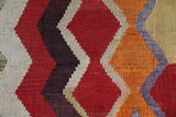 Vintage kilim rug in living room setting, old rug, antique rug, pastel colors, faded colors, Turkish rug, vintage rug, soft rug, Portland, Oregon, rug store, rug shop, local shop, earthy tones, earthy colors, warm colors
