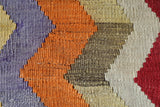 Vintage kilim rug in living room setting, old rug, antique rug, pastel colors, faded colors, Turkish rug, vintage rug, soft rug, Portland, Oregon, rug store, rug shop, local shop, earthy tones, earthy colors, warm colors