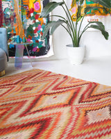 Vintage kilim rug in room decor setting, old rug, antique rug, pastel colors, faded colors, Turkish rug, vintage rug, soft rug, Portland, Oregon, rug store, rug shop, local shop,  antique kilim rug, bold colors, bright colors, faded colors