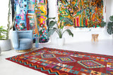 Vintage kilim rug in living room setting, bright colors, wild shaman, soft rug, bold color, Portland, Oregon, rug store, rug shop, local shop, vintage rug, modern kilim, warm colors, antique rug, antique kilim