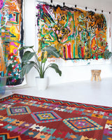 Vintage kilim rug in living room setting, bright colors, wild shaman, soft rug, bold color, Portland, Oregon, rug store, rug shop, local shop, vintage rug, modern kilim, warm colors, antique rug, antique kilim