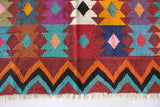 Vintage kilim rug in living room setting, bright colors, wild shaman, soft rug, bold color, Portland, Oregon, rug store, rug shop, local shop, vintage rug, modern kilim, warm colors, antique rug, antique kilim