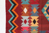 Vintage kilim rug in living room setting, bright colors, wild shaman, soft rug, bold color, Portland, Oregon, rug store, rug shop, local shop, vintage rug, modern kilim, warm colors, antique rug, antique kilim