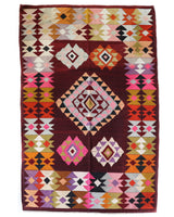Vintage kilim rug in living room setting, bright colors, wild shaman, soft rug, bold color, Portland, Oregon, rug store, rug shop, local shop, vintage rug, modern kilim, warm colors, antique rug, antique kilim