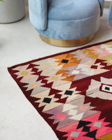 Vintage kilim rug in living room setting, bright colors, wild shaman, soft rug, bold color, Portland, Oregon, rug store, rug shop, local shop, vintage rug, modern kilim, warm colors, antique rug, antique kilim