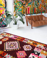 Vintage kilim rug in living room setting, bright colors, wild shaman, soft rug, bold color, Portland, Oregon, rug store, rug shop, local shop, vintage rug, modern kilim, warm colors, antique rug, antique kilim
