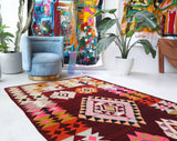 Vintage kilim rug in living room setting, bright colors, wild shaman, soft rug, bold color, Portland, Oregon, rug store, rug shop, local shop, vintage rug, modern kilim, warm colors, antique rug, antique kilim