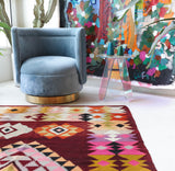 Vintage kilim rug in living room setting, bright colors, wild shaman, soft rug, bold color, Portland, Oregon, rug store, rug shop, local shop, vintage rug, modern kilim, warm colors, antique rug, antique kilim