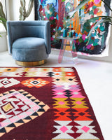 Vintage kilim rug in living room setting, bright colors, wild shaman, soft rug, bold color, Portland, Oregon, rug store, rug shop, local shop, vintage rug, modern kilim, warm colors, antique rug, antique kilim
