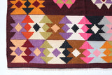 Vintage kilim rug in living room setting, bright colors, wild shaman, soft rug, bold color, Portland, Oregon, rug store, rug shop, local shop, vintage rug, modern kilim, warm colors, antique rug, antique kilim