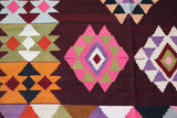 Vintage kilim rug in living room setting, bright colors, wild shaman, soft rug, bold color, Portland, Oregon, rug store, rug shop, local shop, vintage rug, modern kilim, warm colors, antique rug, antique kilim