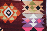 Vintage kilim rug in living room setting, bright colors, wild shaman, soft rug, bold color, Portland, Oregon, rug store, rug shop, local shop, vintage rug, modern kilim, warm colors, antique rug, antique kilim