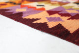 Vintage kilim rug in living room setting, bright colors, wild shaman, soft rug, bold color, Portland, Oregon, rug store, rug shop, local shop, vintage rug, modern kilim, warm colors, antique rug, antique kilim