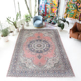 Vintage Turkish rug in living room setting, old rug, antique rug, pastel colors, faded colors, Turkish rug, vintage rug, soft rug, Portland, Oregon, rug store, rug shop, local shop