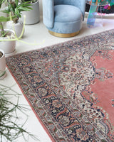 Vintage Turkish rug in living room setting, old rug, antique rug, pastel colors, faded colors, Turkish rug, vintage rug, soft rug, Portland, Oregon, rug store, rug shop, local shop