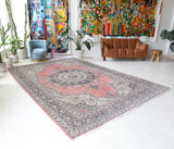 Vintage Turkish rug in living room setting, old rug, antique rug, pastel colors, faded colors, Turkish rug, vintage rug, soft rug, Portland, Oregon, rug store, rug shop, local shop
