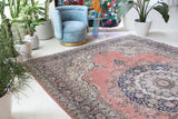 Vintage Turkish rug in living room setting, old rug, antique rug, pastel colors, faded colors, Turkish rug, vintage rug, soft rug, Portland, Oregon, rug store, rug shop, local shop