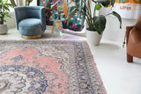 Vintage Turkish rug in living room setting, old rug, antique rug, pastel colors, faded colors, Turkish rug, vintage rug, soft rug, Portland, Oregon, rug store, rug shop, local shop