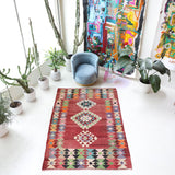 Vintage kilim rug in living room setting, old rug, antique rug, pastel colors, faded colors, Turkish rug, vintage rug, soft rug, Portland, Oregon, rug store, rug shop, local shop, earthy tones, earthy colors, warm colors