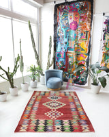 Vintage kilim rug in living room setting, old rug, antique rug, pastel colors, faded colors, Turkish rug, vintage rug, soft rug, Portland, Oregon, rug store, rug shop, local shop, earthy tones, earthy colors, warm colors