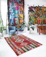 Vintage kilim rug in living room setting, old rug, antique rug, pastel colors, faded colors, Turkish rug, vintage rug, soft rug, Portland, Oregon, rug store, rug shop, local shop, earthy tones, earthy colors, warm colors