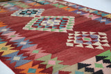 Vintage kilim rug in living room setting, old rug, antique rug, pastel colors, faded colors, Turkish rug, vintage rug, soft rug, Portland, Oregon, rug store, rug shop, local shop, earthy tones, earthy colors, warm colors