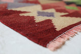 Vintage kilim rug in living room setting, old rug, antique rug, pastel colors, faded colors, Turkish rug, vintage rug, soft rug, Portland, Oregon, rug store, rug shop, local shop, earthy tones, earthy colors, warm colors